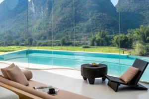 a living room with a view of a mountain at Paddy Fields Resort-Guilin Shuidaotian in Yangshuo +214 photos