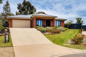 a house with a driveway in front of it at Alpine Corner - Lux and Quiet in Thurgoona