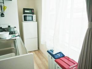 Η κουζίνα ή μικρή κουζίνα στο (A5)NEW OPEN☆中心エリアへ好アクセス　格安＆美室で快適空間　サービスアパ―トメントSAPPORO南8条A5 +37 φωτογραφίες