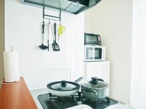 Η κουζίνα ή μικρή κουζίνα στο (A5)NEW OPEN☆中心エリアへ好アクセス　格安＆美室で快適空間　サービスアパ―トメントSAPPORO南8条A5