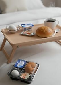 a wooden table with a tray of food on it at Sun City in Aswan +17 photos