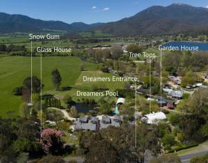 an aerial view of a small town with mountains in the background at Dreamers Mt Beauty in Mount Beauty