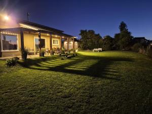 a house with a large yard in front of it at Casa en Chapa in La Estafeta