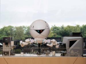 a robot is sitting on top of a machine at Shangri-La Yiwu in Yiwu