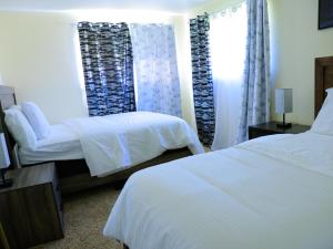 En eller flere senge i et værelse på A Nice and Cozy Home in Fairborn