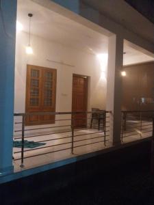 a front porch of a house at night at Munroe Heritage Inn in Munroe Island