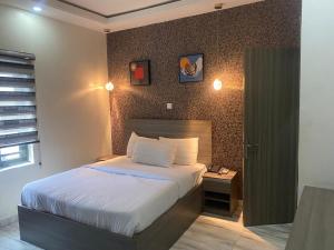 Ένα ή περισσότερα κρεβάτια σε δωμάτιο στο House 32 Hotels and Suites