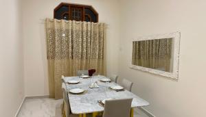 a dining room with a table and chairs at Silva Villa Negombo in Negombo