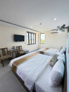 Ένα ή περισσότερα κρεβάτια σε δωμάτιο στο Như Ý Hotel Tây Ninh