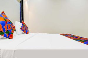 Postel nebo postele na pokoji v ubytování Hotel Queen Inn