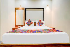 Postel nebo postele na pokoji v ubytování Hotel Queen Inn