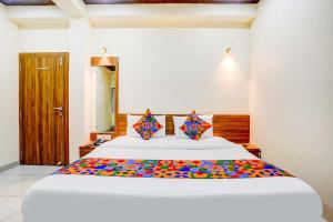 Postel nebo postele na pokoji v ubytování Hotel Queen Inn