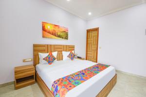 Postel nebo postele na pokoji v ubytování Hotel Renu Rooms