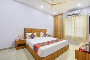 Ένα ή περισσότερα κρεβάτια σε δωμάτιο στο Hotel Renu Rooms
