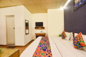 Ένα ή περισσότερα κρεβάτια σε δωμάτιο στο FabHotel Z Heart