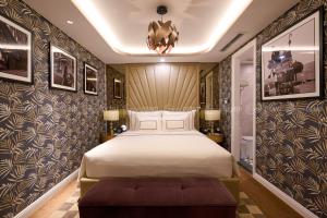 Postel nebo postele na pokoji v ubytování The Haron Hanoi Boutique Hotel