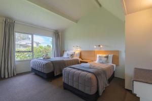 Ένα ή περισσότερα κρεβάτια σε δωμάτιο στο Andorra Motel +39 φωτογραφίες