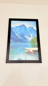 a picture of a picture of a lake with mountains at Zillion’s Bliss - Basement Suite in Calgary