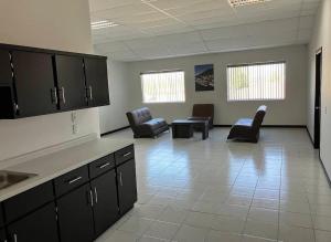 a large room with chairs and a waiting room at Hotel Plaza Berrendo in Campo Menohita 307