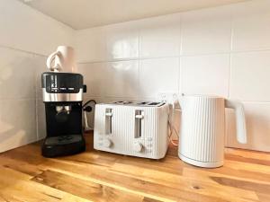 two toasters and a coffee maker on a kitchen floor at Casa Al Mare- family and pet friendly, close to everything in Gold Coast