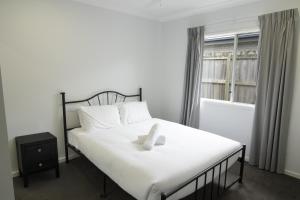 Ένα ή περισσότερα κρεβάτια σε δωμάτιο στο Spacious 4-Bed House in Leafy Plainland