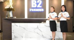two women standing in front of a marble counter at B2 Amata Nakorn Premier Hotel in Ban Chak Samo +114 photos