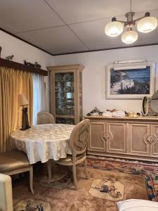 a dining room with a table and some chairs at Oasis Minamiyukigaya in Tokyo