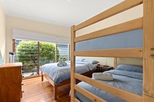 Voodi või voodid majutusasutuse Tomorrow Jervis Bay - Waterfront with Swimming Pool toas