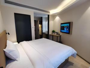 Postel nebo postele na pokoji v ubytování GreenTree Inn Express Fuzhou Linchuan District Gandong Auto City + 54 fotografií