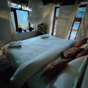 Postel nebo postele na pokoji v ubytování Miller's Cafe and Cottage