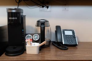 a coffee maker and a phone on a table at Mountain View Hope Motel in Hope