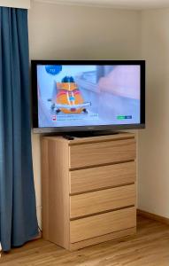 a flat screen tv sitting on top of a dresser at Modern Gemütlich in Pflach