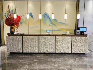 Vstupní hala nebo recepce v ubytování Yinhu Junyi Hotel（Wildlife Park）