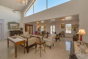 a large living room with couches and a fireplace at SaffronStays Brunton House - 3BR Villa with Pool & Alfresco dining in Alibaug