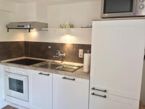 Η κουζίνα ή μικρή κουζίνα στο Ferienhaus In Bracht Mit Garten