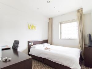 Voodi või voodid majutusasutuse Hearton Hotel Higashi-Shinagawa toas