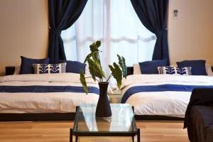 Ένα ή περισσότερα κρεβάτια σε δωμάτιο στο 伊良波山荘 2