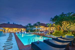 a swimming pool in a resort at night at Neona Spacious 4 BR Private Pool Villa ZN364 in Tanah Lot