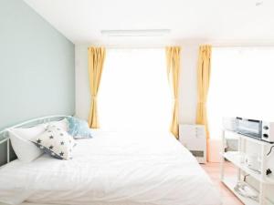 Ένα ή περισσότερα κρεβάτια σε δωμάτιο στο （B5）アクセス良好！快適2名まで滞在可☆サービスアパ―トメントSAPPORO南8条B5