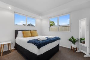 Ένα ή περισσότερα κρεβάτια σε δωμάτιο στο Bayfair Break - Mt Maunganui