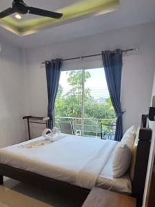 Una cama o camas en una habitación de Ketki Luxury Pool Villa Seaflare Pattaya