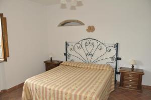 Postel nebo postele na pokoji v ubytování Agriturismo Renai e Monte II
