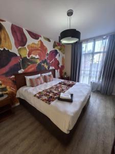 En eller flere senge i et værelse på Unit 25 Oceanic