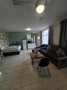 En eller flere senge i et værelse på Unit 25 Oceanic