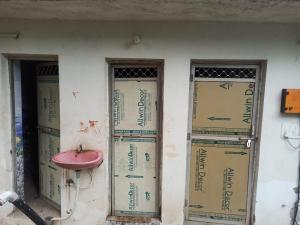 a wall with three doors with a sink on it at Hariom Homestay in Barwa Sāgar