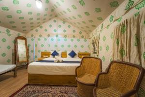 Ένα ή περισσότερα κρεβάτια σε δωμάτιο στο Heritage Villa Resort Camp +28 φωτογραφίες