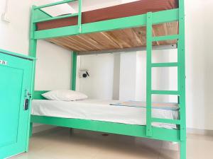 Ένα ή περισσότερα κρεβάτια σε δωμάτιο στο Ishu beach hostel +12 φωτογραφίες