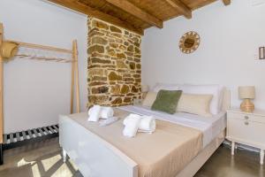 Llit o llits en una habitació de Plismoní