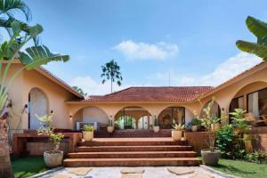 a house with a staircase in front of it at Neola Amazing 5 BR Private Pool Villa ZN365 in Tanah Lot