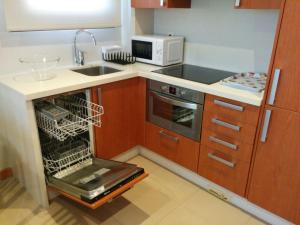 A kitchen or kitchenette at Apartamentos Lanceata I